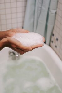 Crop-woman-with-foam in-hands