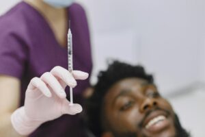 Close-Up-Shot-of-Person-Holding-a-Syringe